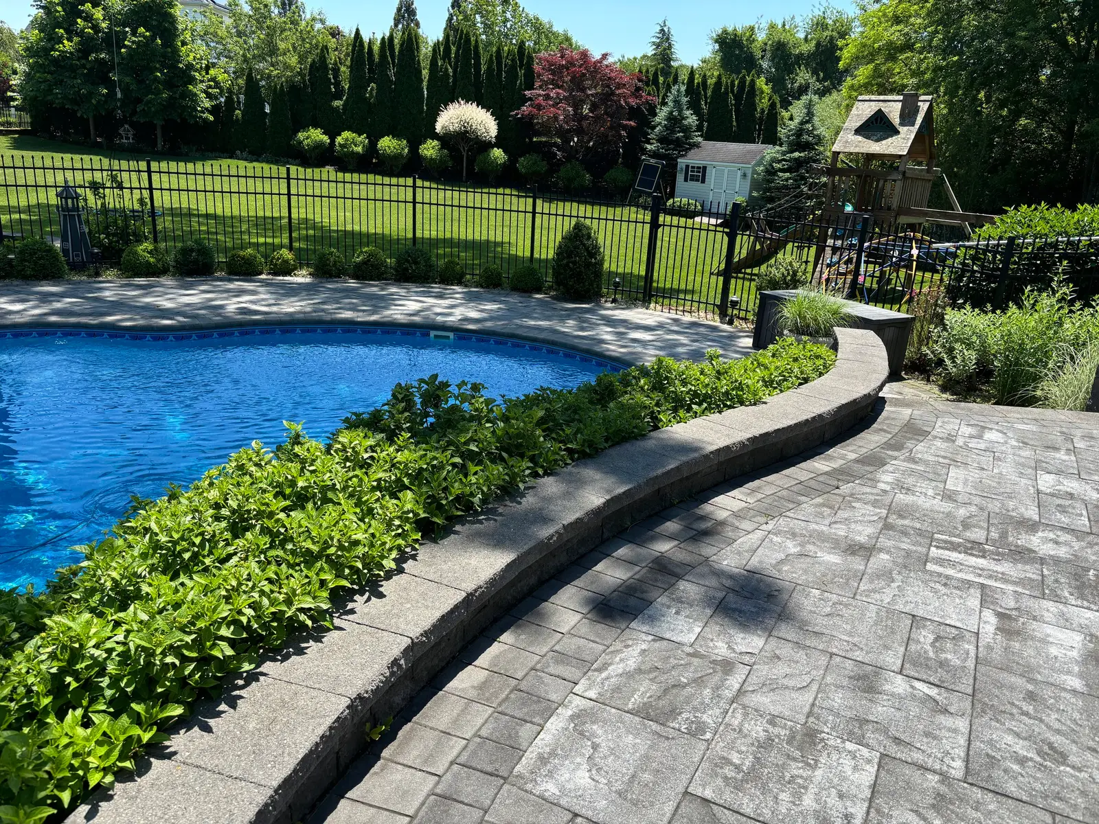 Gray paver pool deck after restoration