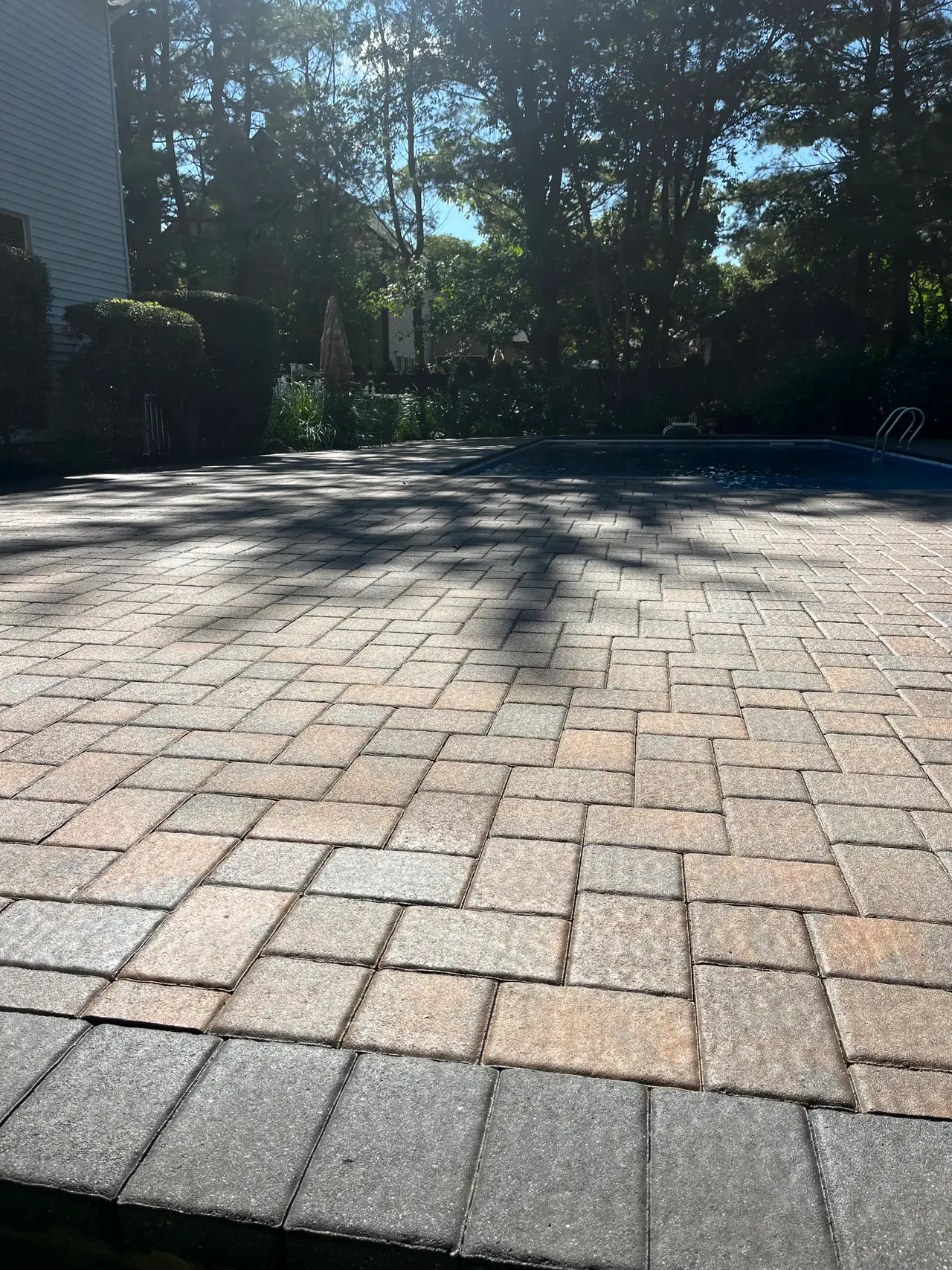 Sealed paver pool deck in Miller Place